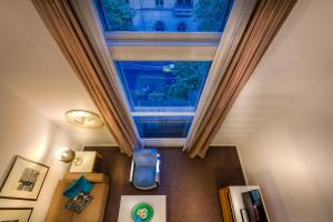 an overhead view of a room with a large window at Treasury on Collins in Melbourne