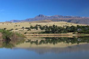 a large body of water with mountains in the background at Treks, Trips and Trails in Champagne Valley