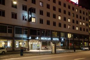 a night view of a mexican hotel on a street at ProfilHotels Mercur in Copenhagen