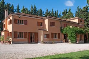 a large house with a driveway in front of it at Villa degli Scoiattoli in SantʼElpidio a Mare