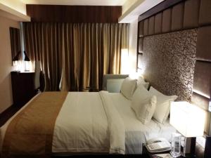 Postel nebo postele na pokoji v ubytování Hotel Oxina Lygon