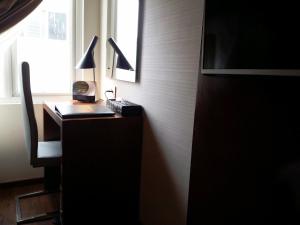 TV a/nebo společenská místnost v ubytování Hotel Oxina Lygon