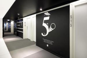 a hallway with a number sign on a wall at Eurostars Book Hotel in Munich
