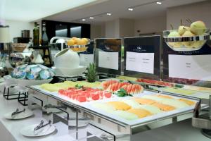 a buffet filled with lots of different types of food at Eurostars Book Hotel in Munich