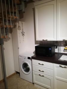 A kitchen or kitchenette at Marmot Apartment