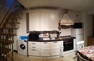 A kitchen or kitchenette at Marmot Apartment