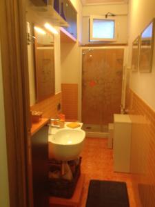 a bathroom with a toilet and a sink and a shower at Domus Felix in Sorrento