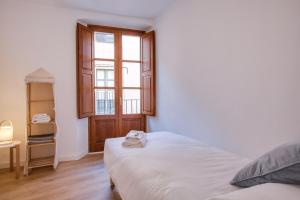 Posteľ alebo postele v izbe v ubytovaní Flateli Cort Reial