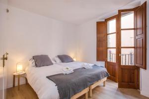 Posteľ alebo postele v izbe v ubytovaní Flateli Cort Reial