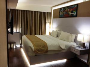 Postel nebo postele na pokoji v ubytování Hotel Oxina Lygon