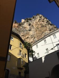 a building with a mountain in the background at 1Dest - Living The Dream in Arco
