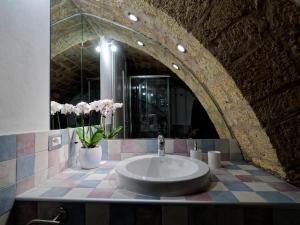 a bathroom with a sink and a mirror at Loft 34 in Tarquinia +27 photos
