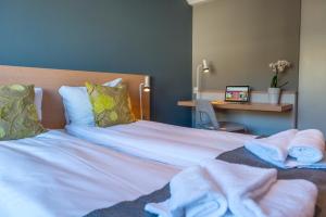 Postel nebo postele na pokoji v ubytování Fast Hotel Svolvær