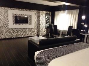 Postel nebo postele na pokoji v ubytování Hotel Oxina Lygon
