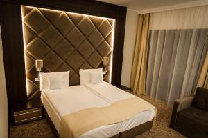 Ένα ή περισσότερα κρεβάτια σε δωμάτιο στο Hotel President SPA