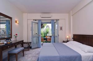 Postel nebo postele na pokoji v ubytování Harmony Hotel Apartments
