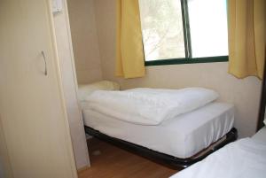 Кровать или кровати в номере Brevar - Toscane