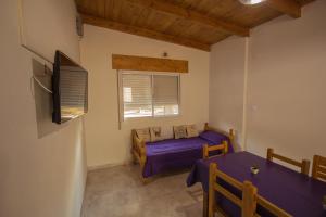 מיטה או מיטות בחדר ב-Maliva Cabanas