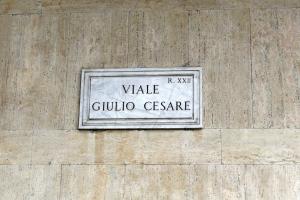 a sign on the side of a building at Houspitality Caesar Bed & Breakfast in Rome