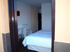 Katil atau katil-katil dalam bilik di Hotel Las Casas de Pandreula