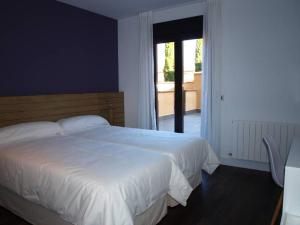 A bed or beds in a room at Hotel Las Casas de Pandreula
