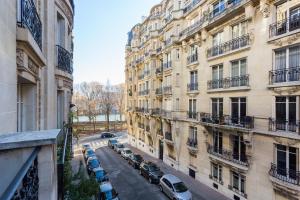 a view of a street in front of buildings at CMG - Suite Premium Tour Eiffel - 31 in Paris