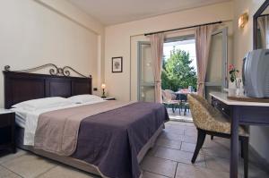 Postel nebo postele na pokoji v ubytování Harmony Hotel Apartments