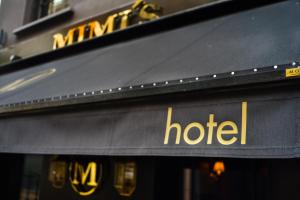 a hotel sign on the front of a building at Mimi's Hotel Soho in London