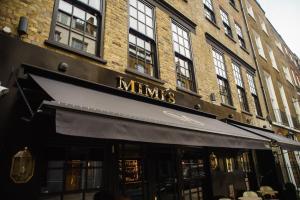 a store front of a building with a black awning at Mimi's Hotel Soho in London