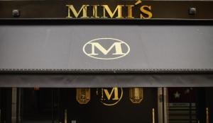 a minis sign on the front of a store at Mimi's Hotel Soho in London