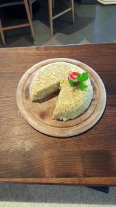 a piece of cake on a plate on a table at Panorama Restaurant Sterzingerhaus 1.930m in Vipiteno +35 photos