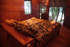 Katil atau katil-katil dalam bilik di Bedda Eco Cottages