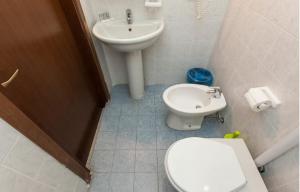 Koupelna v ubytování Hotel Greco