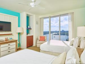 a hotel room with two beds and a television at Margaritaville Hollywood Beach Resort in Hollywood