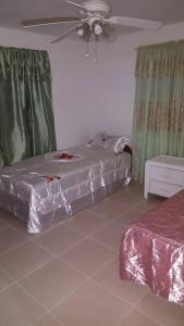 Postel nebo postele na pokoji v ubytování Cynson Villa Holiday Accommodations