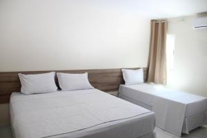 Postel nebo postele na pokoji v ubytování Hotel Executive