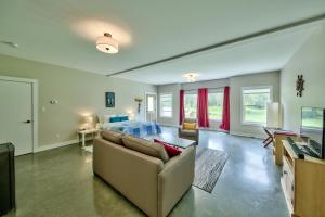 a living room with a couch and a bed at Peaks Bed and Breakfast in Sun Peaks