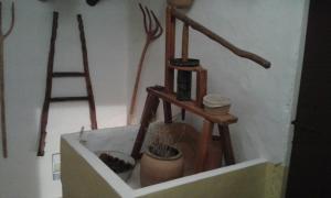 a shelf with several different kinds of tools on a wall at Casa Elina Lucena in Lucena del Cid