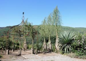 a garden with a gazebo and some plants at Quinta de Albergaria in Facha +4 photos
