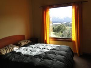 En eller flere senge i et værelse på Cabañas Lomas del Salto