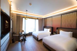 Voodi või voodid majutusasutuse MGM Cotai toas