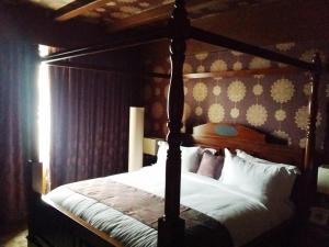 Postel nebo postele na pokoji v ubytování Hotel Oxina Lygon