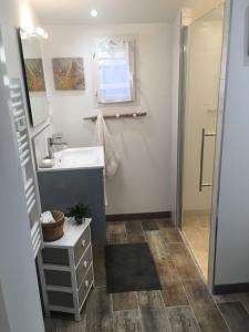 a bathroom with a sink and a mirror at Carpédiem in Sanary-sur-Mer