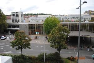 a building with a parking lot in front of it at Monteurzimmer-Apartment Scholl Pforzheim in Pforzheim