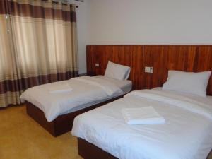 เตียงในห้องที่ Phouluang Hotel