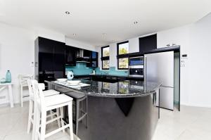 A kitchen or kitchenette at The Ultimate Ocean View - A Luxury Home