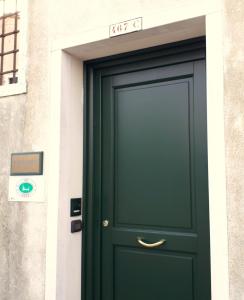 a door that has a blue door on it at Casanova Fourrooms in Venice