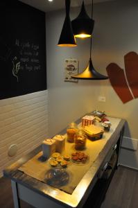 a counter in a kitchen with some food on it at Le Sartorie in Pozzuolo del Friuli