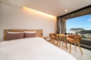Postel nebo postele na pokoji v ubytování Pino Hotel