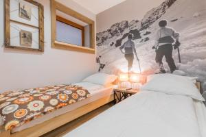 Posteľ alebo postele v izbe v ubytovaní Apartamenty Rockus LUX & SPA Zakopane